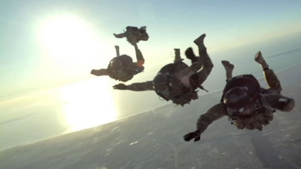 Navy SEALs on a high-altitude jump in a scene from <i>Act of Valor</i>.