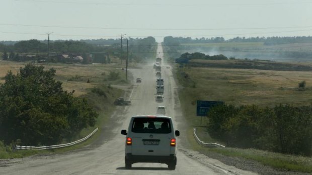 The convoy including the OSCE, Australian Federal Police and their Dutch counterparts making their way to the MH17 crash site.