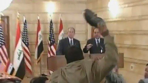 Jail term reduced .. Muntazer al-Zaidi throws a shoe at George Bush.