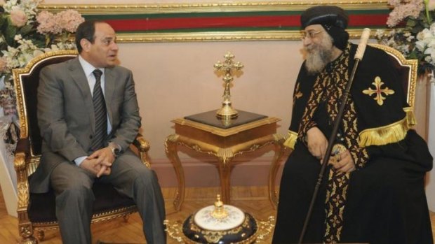 On the campaign trail: Former army chief and defence minister Abdel Fattah al-Sisi, left, meets Coptic Pope Tawadros II on the eve of Easter.