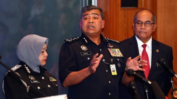 Tan Sri Khalid Ibrahim, Inspector General Police of Malaysia (centre) briefs the media on the progress of their investigations on in Kuala Lumpur, Malaysia.