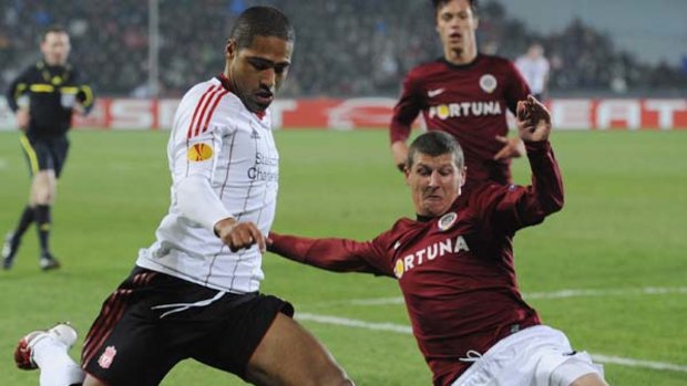 Glen Johnson of Liverpool looks to cross the ball before a challenge of Manuel Pamic of Sparta Prague.