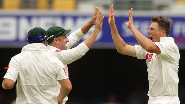 James Pattinson celebrates his first Test wicket, removing New Zealand captain Ross Taylor for 14.