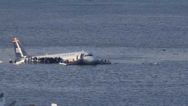 Passengers stand on the wings of a US Airways plane after it landed in the Hudson River in New York. The Airbus, with about 150 passengers and crew on board, had just taken off from La Guardia Airport.