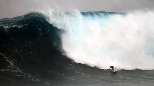 The big one: Rowley rides the 15-metre-plus Jaws wave in January.