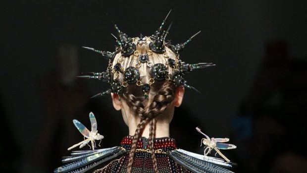 A model presents a creation by Indian designer Manish Arora as part of his autumn-winter women's ready-to-wear collection during Paris Fashion Week.