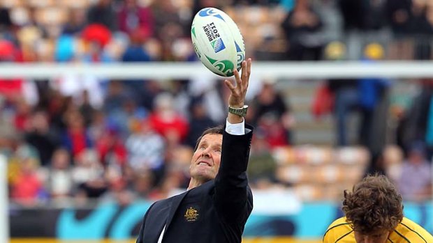 Robbie Deans helps the Wallabies warm-up before their clash with Russia today.