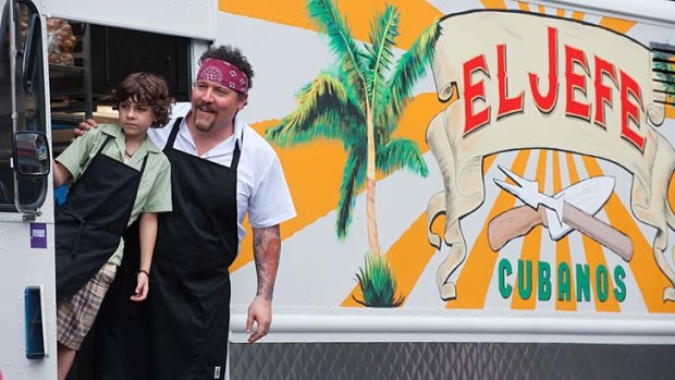 Change of diet: Emjay Anthony and Jon Favreau on the road in a taco truck in <i>Chef</i>.
