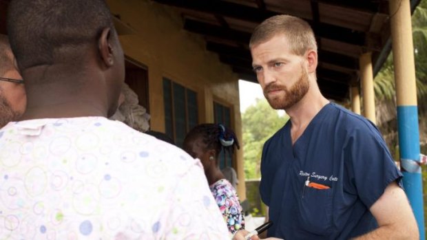 Dr Kent Brantly (right), one of the two Americans who contracted Ebola, works at an Ebola isolation ward at a mission hospital outside of Monrovia, Liberia.
