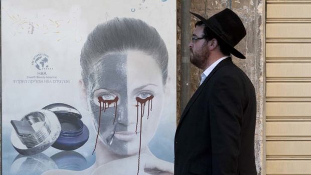 The face of extremism ... across Jerusalem posters featuring women have been defaced by ultra-Orthodox Haredim.