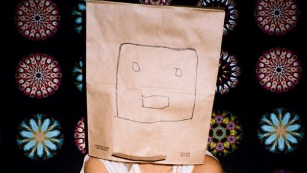 Singer songwriter Sia, with a paperbag over her head.