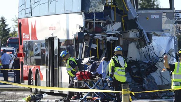Ottawa: A passenger is taken to an ambulance following the Via Rail train and city bus collision.
