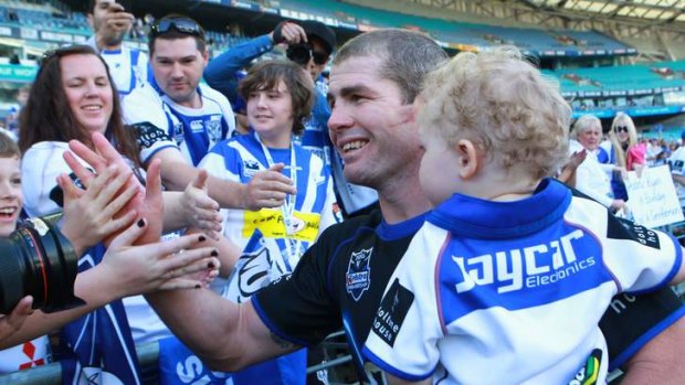 Bulldogs captain Andrew Ryan with his son at his final game in 2011.