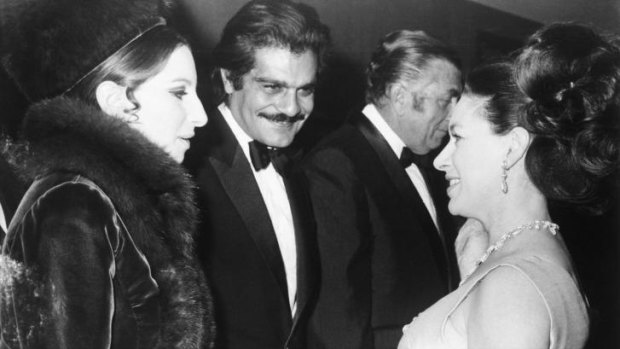 Britain's Princess Margaret, right, talks with Barbra Streisand and Omar Sharif in 1969.