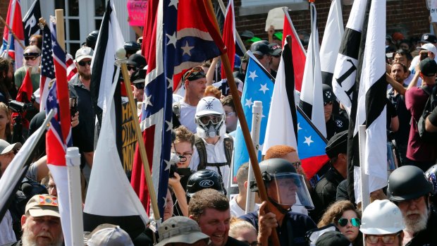 White nationalist demonstrators are surrounded by counter demonstrators in Charlottesville.