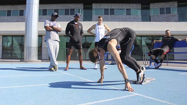 Asafa Powell in Melbourne during the week checking out the form of young Australian sprinter Jarrod Geddes.
