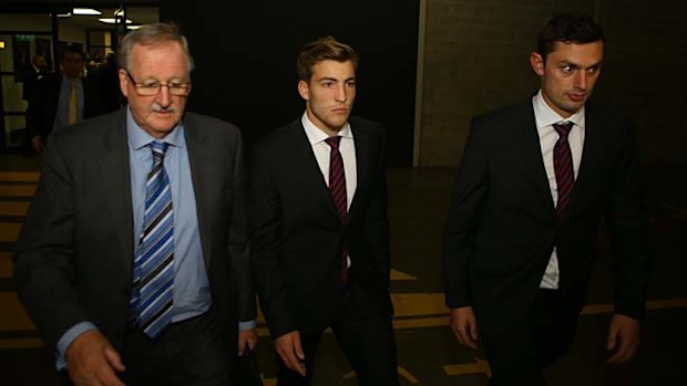 The Melbourne contingent, including Jack Viney (centre), arrive at AFL House.