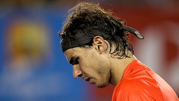 Rafael Nadal confronts the prospect of being dumped from the Australian following a thigh injury.