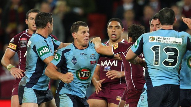 The biff ... several scuffles broke out after full-time at a sold-out Suncorp Stadium in Brisbane last night.