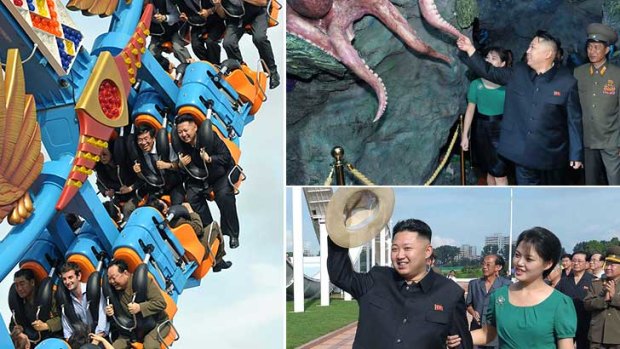 Taken for a ride ... British charge d’affaires Barnaby Jones, bottom centre, takes a spin with Kim Jong Un, top right in this photo released by the Korean Central News Agency of the  completion ceremony of the Rungna People's Pleasure Ground in Pyongyang, North Korea.