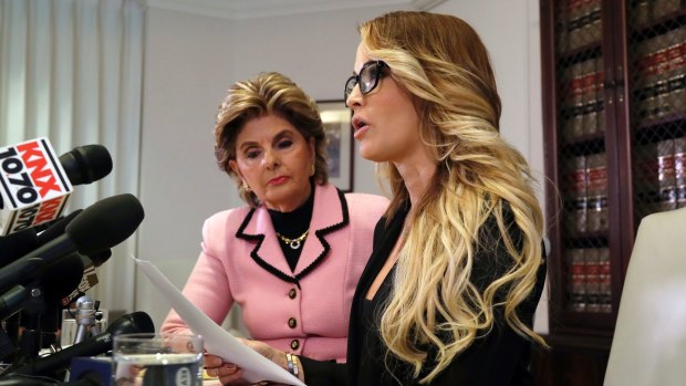 Jessica Drake speaks to reporters in Los Angeles, accompanied by her attorney, Gloria Allred. 