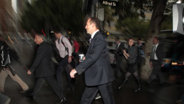 Opposition leader Tony Abbott goes for a stroll around Circular Quay in Sydney.
