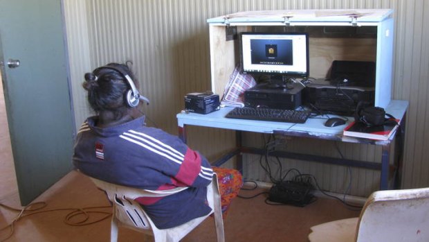 Remote networking ... Cynthia Lauder surfs the web in her home community of Mungalawurru, which is about 70 kilometres from Tennant Creek in the Northern Territory.
