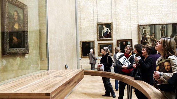 Visitors brace long queues at Paris' Louvre museum to see Leonardo Da Vinci's Mona Lisa.