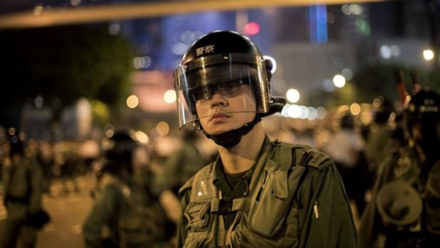 Ready to increase use of force: A Hong Kong police officer at pro-democracy demonstrations.