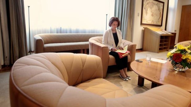Prime Minister Julia Gillard sorts through her paperwork in her office at Parliament House.