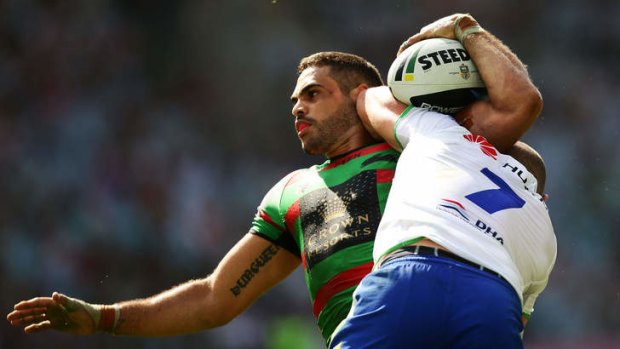 Tough times: Greg Inglis is taken down by Terry Campese as the Rabbitohs again failed to live up to expectations.