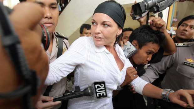 Schapelle Corby  is escorted by police to a courtroom in Denpasar in 2006.