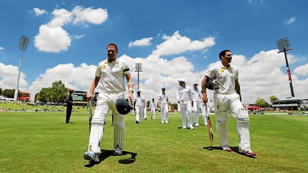 Australia's Ryan Harris and Mitchell Johnson wear black armbands in honour of Luke Batty on day two of the first Test against South Africa.
