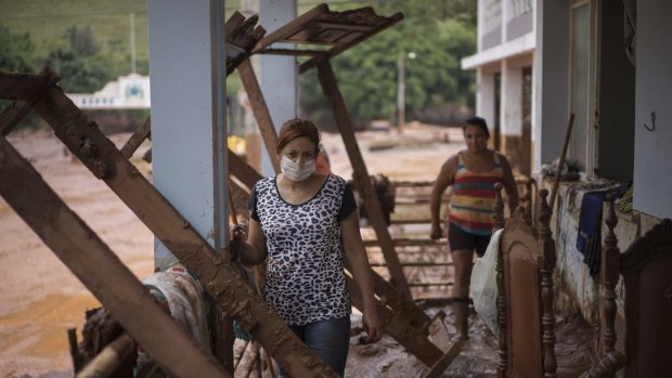 People inspect the damage to their homes in Barra Longa in Minas Gerais state, Brazil.