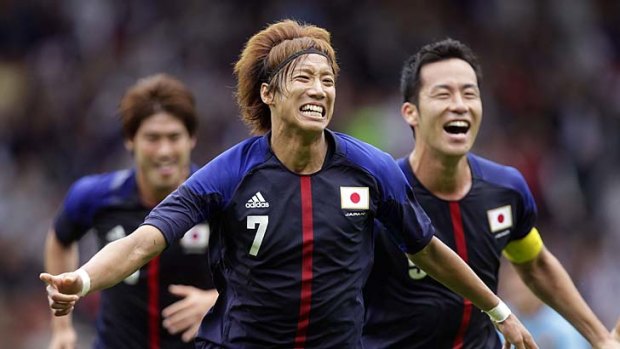 Rising sons &#8230; Otsu Yuki celebrates a goal against Spain.