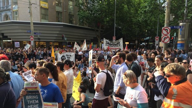 Hundreds of people protesting against the treatment of refugees on Manus Island have shut down a major CBD street. 