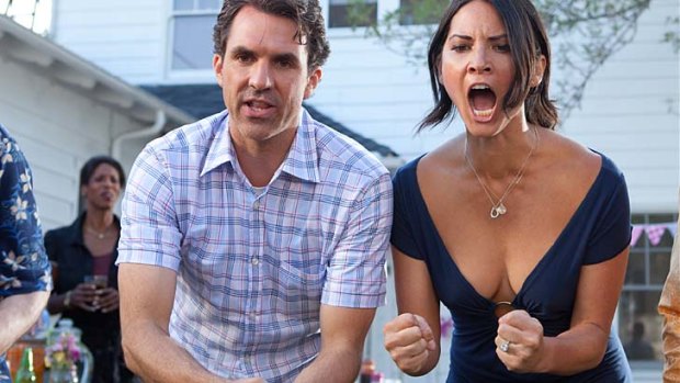 Paul Schneider and Olivia Munn in a scene from <i>The Babymakers</i>.