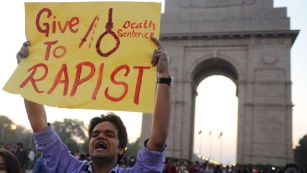 Indian students and activists carry placards at India Gate in New Delhi, during a protest following the gang-rape of a student in the Indian capital last December. 