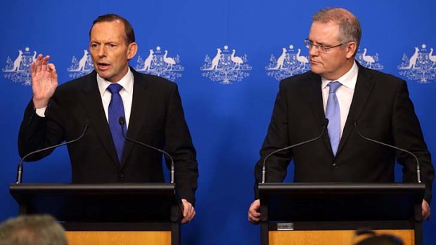 In control: Prime Minister Tony Abbott and Immigration Minister Scott Morrison celebrate the six-month anniversary of no refugee boat arrivals.