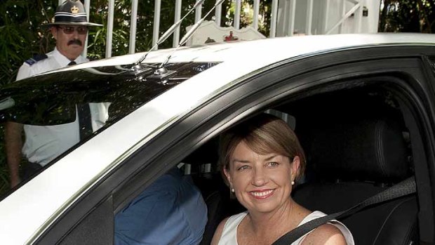 Anna Bligh leaves government house after officially calling an election in Queensland for March 24.