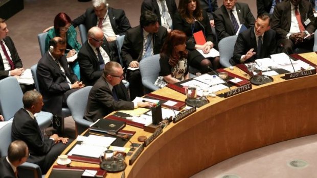 Tony Abbott (right) addresses the UN Security Council last month. The council unanimously endorsed measures against Islamic State.