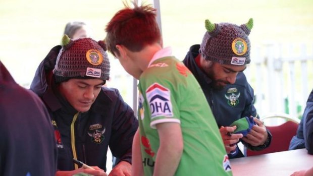 Jeremy Hawkins and Reece Robinson at a Raiders fan session on Thursday. Robinson is likely to replace Hawkins, who was blocked from making his NRL debut on Sunday because of the second tier salary cap, in Canberra's team to take on the Gold Coast.