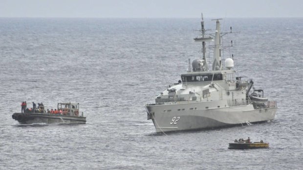 A Royal Australian Navy Ship takes part in a rescue effort of suspected asylum seekers after their boat capsized on June 22.