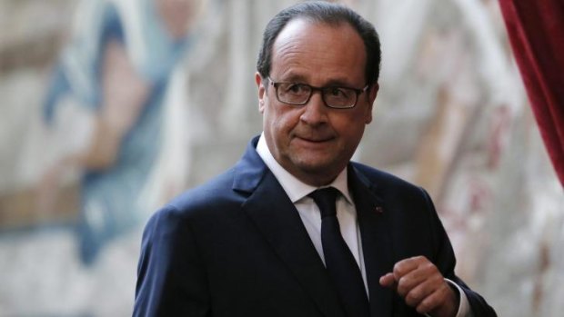 French President Francois Hollande arrives to deliver a speech about French air strikes inside Iraq 