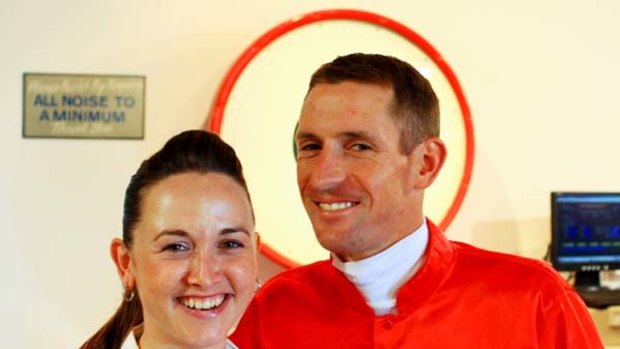 Constant war with weight ... jockey Hugh Bowman celebrates a winner with his understanding wife, Christine, at Rosehill.