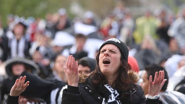 Pies' pain: The Magpie Army braved rain and mud to cheer on their beloved Collingwood from Gosch's Paddock, but the result went against them.