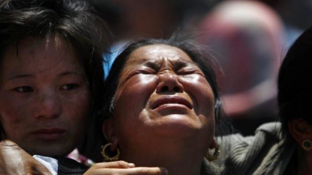 Relatives of mountaineers killed in the avalanche cry during the funeral ceremony in Kathmandu on Monday.