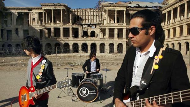 Aiming high ... rock band Kabul Dreams perform in the ruins of a castle in Kabul. "We are aiming for big things ... a record label - a Grammy!"