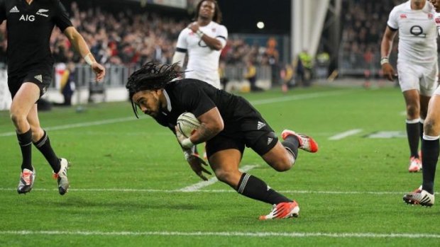 Ma'a Nonu dives over to score for the All Blacks against England at Dunedin.