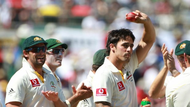 Johnson celebrates the wicket of Chris Tremlett.